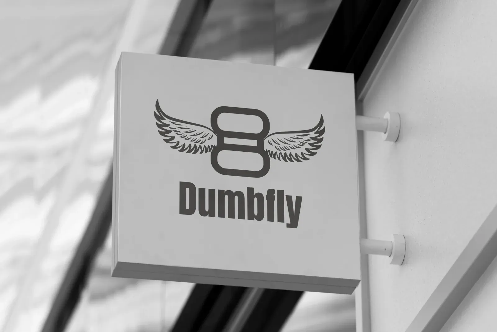 Dumbfly winged-dumbbell gym logo on a street sign
